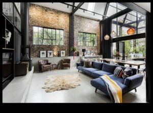 Kādas ir industriālās elegantās dzīvojamās istabas dekorēšanas idejas ar Urban Loft Vibes?